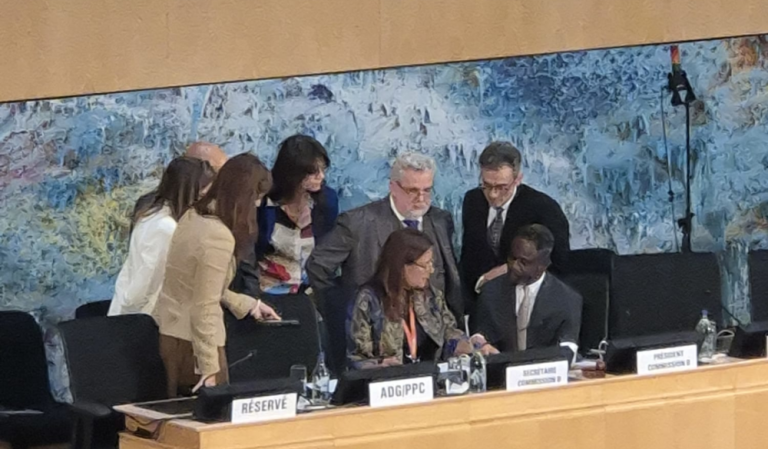 Delegates and the secretariat huddle to negotiate the complex legal text of resolutions on Argentina